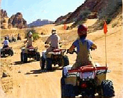 ATV riding in the desert.
